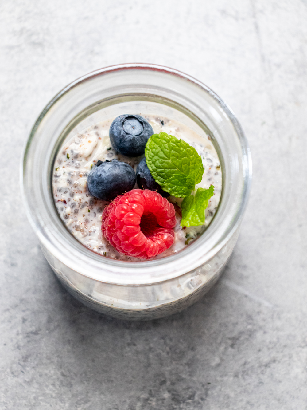 keto overnight oats with berries in a gjass jar