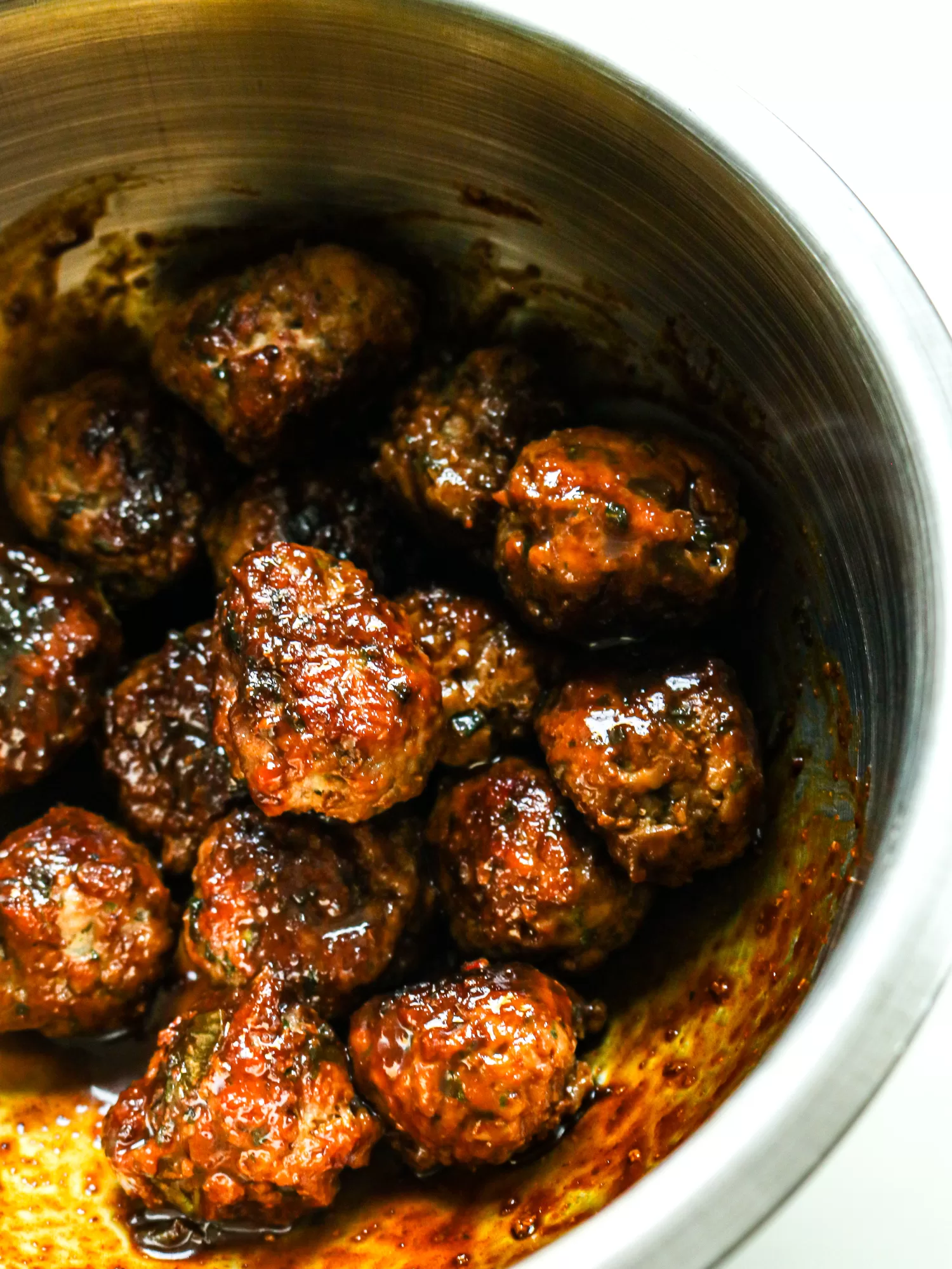 Hoisin glazed meatballs in a pot