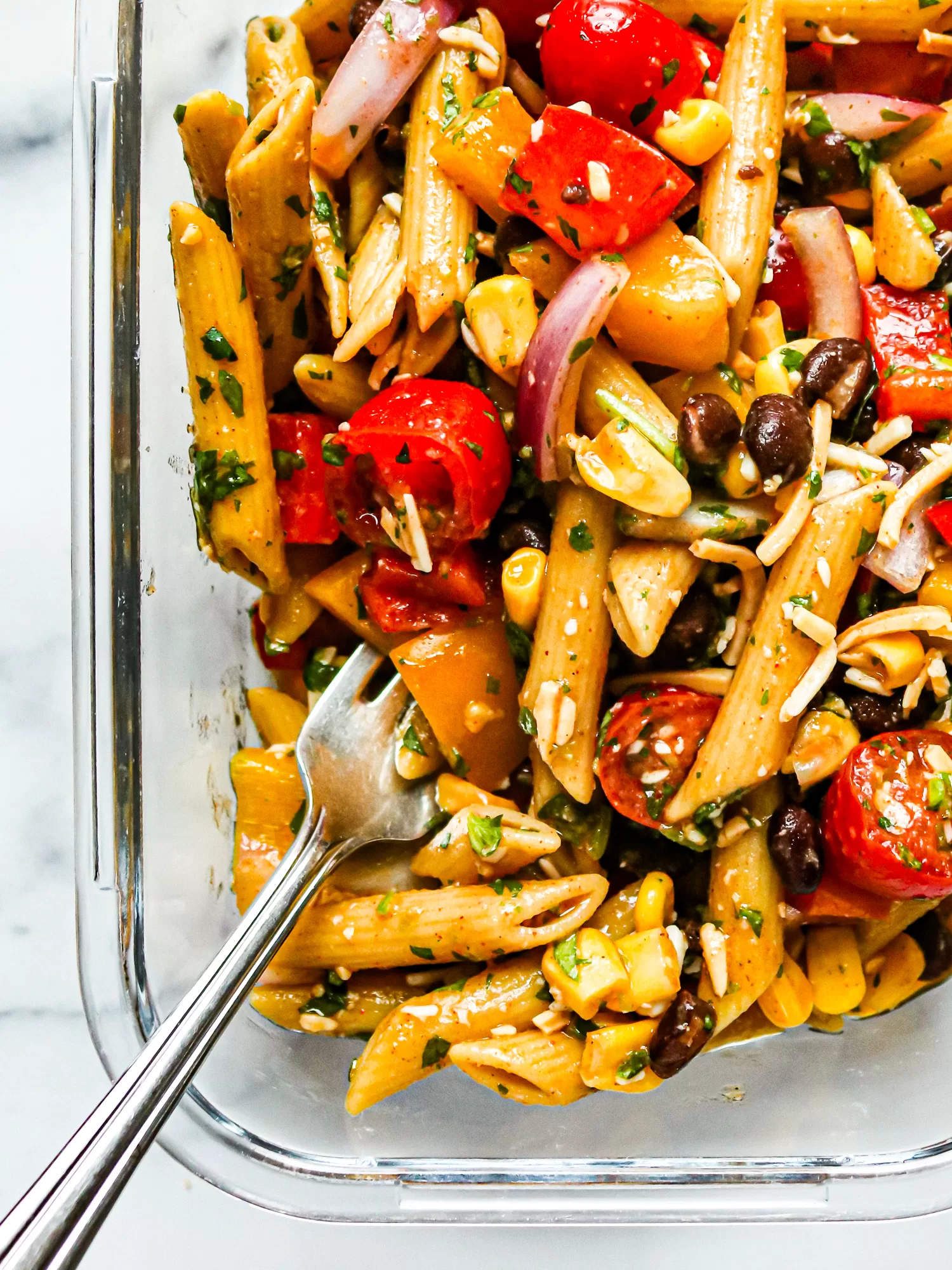 Southwestern Pasta Salad close up in glass dish with serving fork