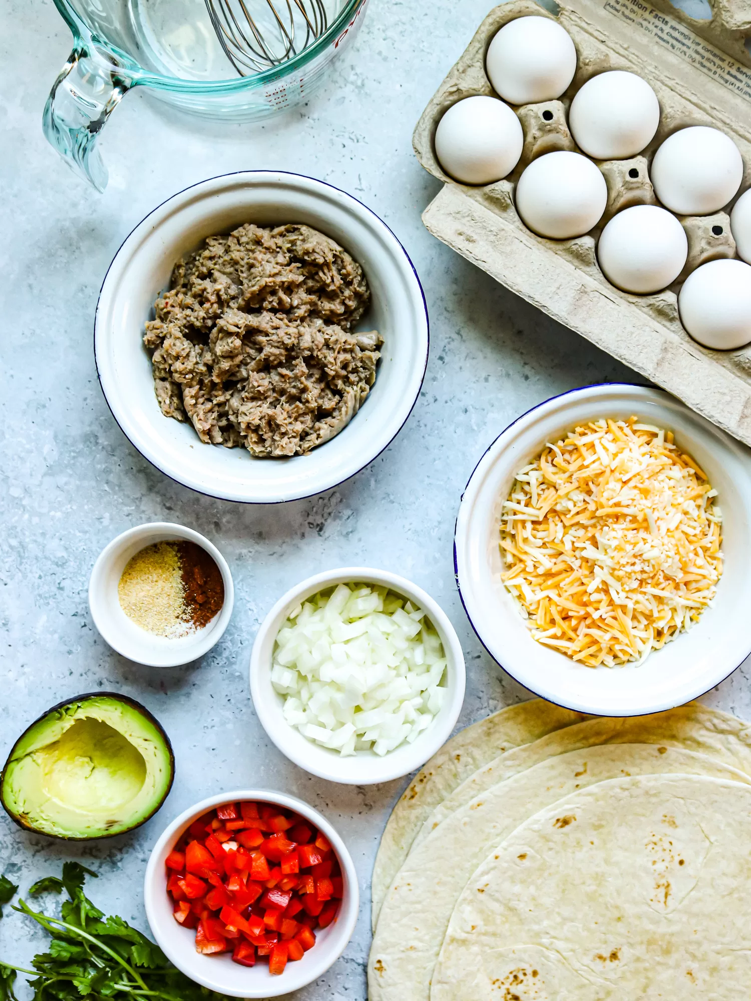 Ingredients for turkey sausage and egg breakfast quesadillas